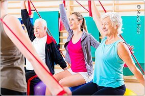 Senior people at fitness course in gym
